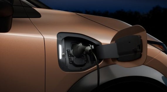 Close-up image of charging cable plugged in | Benton Nissan of Hoover in Hoover AL